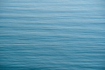 Blue sea water surface with waves, top view