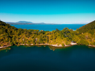 Aerial view of Satonda Island, Indonesia. The idyllic volcanic island of Satonda is fringed by...