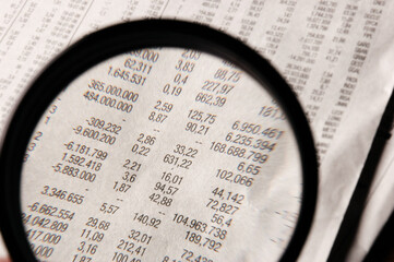 Magnifying glass and sheet accounts