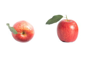 close up of single red apple with leaves on white background