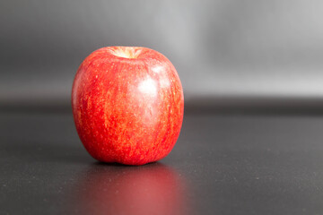 red ripe apple on a dark rustic