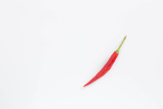 A lot of red hot chili peppers on a white background. a concept hot spice for food. top view, flat lay. Concept red food, .