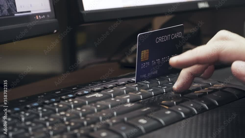 Poster 4k hand key number of credit card on keyboard. video concept for online shopping and ecommerce.