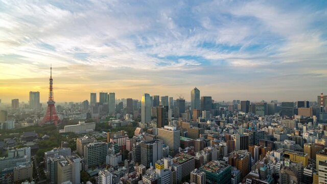 4K UHD time lapse day to night of Tokyo city skyline view and building at Japan with sunset and colorful skyline. Beautiful of cloud and sky in dusk and twillight.