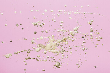 Pink cardboard with gold potal drops and splashes. Creative background