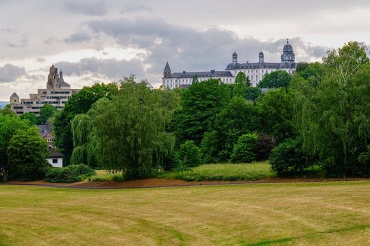 Facade of the Althoff Grandhotel Schloss Bensberg among with green trees captured in Germany