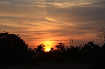 Amazing Sunrise with mountains forests and clouds with Blue orange saffron golden sky