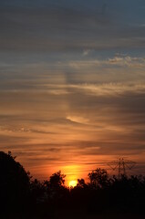 Amazing Sunrise with mountains forests and clouds with Blue orange saffron golden sky