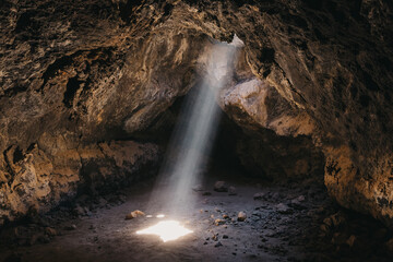 Light beam cuts through the desert cave