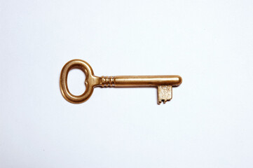 Golden Key against white background.