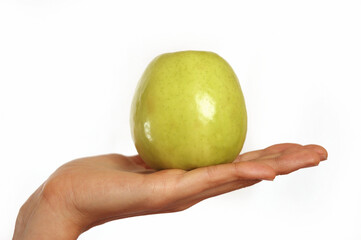 Woman holding green apple in hand