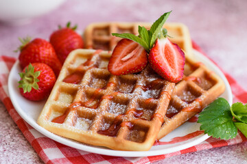 Delicious fresh baked belgian waffles with berries and fruit