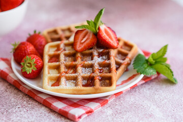 Delicious fresh baked belgian waffles with berries and fruit