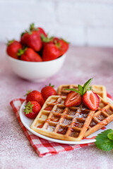 Delicious fresh baked belgian waffles with berries and fruit