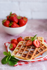 Delicious fresh baked belgian waffles with berries and fruit