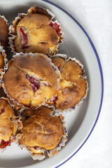 Homemade muffins with red berries and cherries