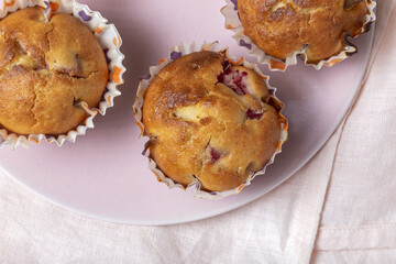Homemade muffins with red berries and cherries