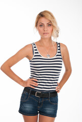 Fototapeta premium Portrait of a beautiful fashion girl in a striped T-shirt isolated over
