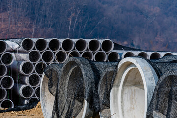 Concrete culverts and corrugated pipes at construction site