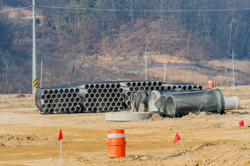 Concrete culverts and corrugated pipes at construction site