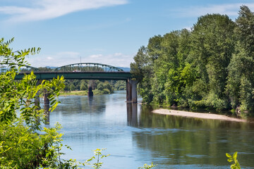 Willamette river in Albany, Oregon, and the bridge over it in summer season