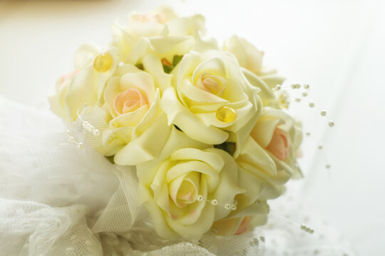 Bride's bouquet on a light wooden table.2.