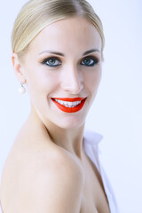 Obraz premium model with professional make-up and bright red lips / beautiful make-up on the face of the model, saturated with bright red lipstick on the lips