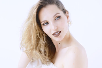 Fototapeta premium blonde portrait make-up white background / professional bright model make-up blond on white background, portrait of beautiful model