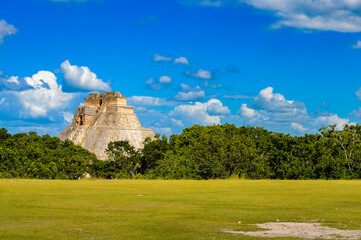 Pyramid of the Magician in the jungle,  a Mesoamerican step pyramid, Uxmal, an ancient Maya city of the classical period. UNESCO World Heritage site
