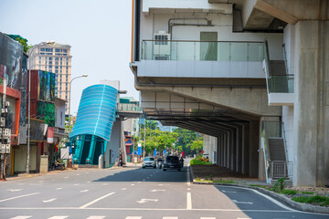 Hanoi street traffic with elevated train station on Hoang Cau street, Vietnam
