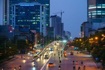 Hanoi cityscape with modern buildings on Nguyen Chi Thanh street at twilight