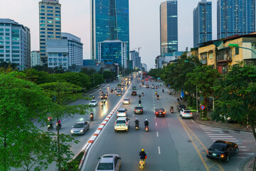 Obraz premium Hanoi cityscape with modern buildings on Nguyen Chi Thanh street at twilight