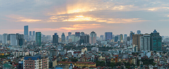 Fototapeta na wymiar Hanoi cityscape at sunset with arising high buildings in Dong Da district