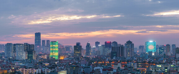 Naklejka premium Hanoi cityscape at sunset with arising high buildings in Dong Da district