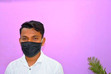 Masked man - protection against influenza virus. Indian man wearing mask for protect. man wear with protective face mask at home. Stop the virus and epidemic diseases.