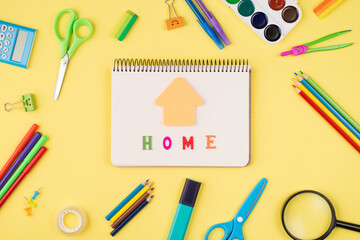 Social distancing concept. Top above overhead view photo of notebook colorful stationery isolated on yellow background