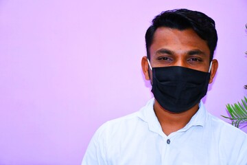 Masked man - protection against influenza virus. Indian man wearing mask for protect. man wear with protective face mask at home. Stop the virus and epidemic diseases.