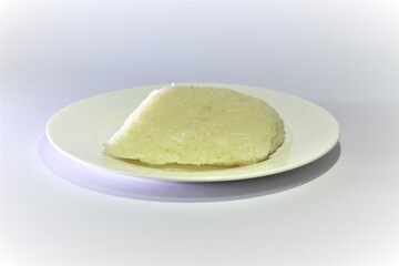 Steamed sticky rice, cooked, put on a plate of ready-to-eat rice.
