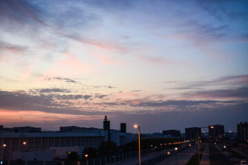 Qatar Doha City Skyline with twilight shades of the sunset over clouds