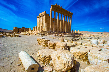 It's Temple of Bel , an ancient stone ruin located in Palmyra, Syria.