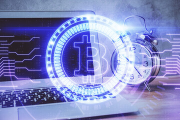 Multi exposure of blockchain and crypto economy theme hologram and table with computer background....