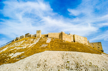 It's Citadel of Aleppo, a large medieval fortified palace of the old city of Aleppo, northern Syria.