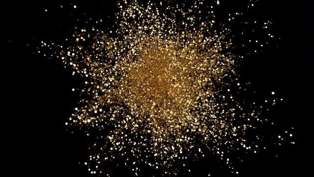 Great Stylish Bright Explosion Glitter with Flickering. Colourful Elegant Confetti Burst on Black Background. Isolated Animation Gold Explode Sparkle Particles. Beautiful Cg 3d Explosion Close-up Shot