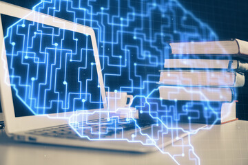 Double exposure of work space with computer and human brain drawing hologram. Brainstorm concept.