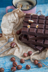 Kraft chocolate with different tastes and aromatic coffee on the table