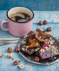 Kraft chocolate with different tastes and aromatic coffee on the table