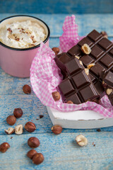 Kraft chocolate with different tastes and aromatic coffee on the table