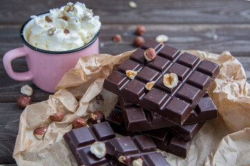 Kraft chocolate with different tastes and aromatic coffee on the table
