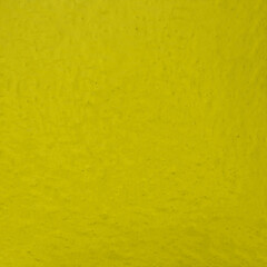 Obraz premium yellow plastered wall background texture