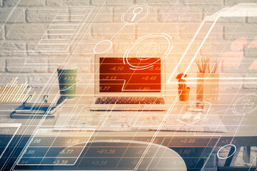 Double exposure of desktop computer and technology theme hologram. Concept of software development.